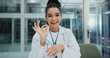 © peopleimages.com - Doctor, portrait and ok results in hospital for healthcare, wellness and professional medical service. Woman, face and consulting in clinic for health, assessment and good news during internship