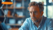 © Stella 16 - Thoughtful businessman think of online project looking at laptop at workplace.Generative AI