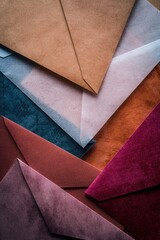 A stack of colorful envelopes piled on top of each other