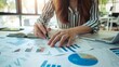 © SHI - Businessman using tablet analyzing sales data and financial report, business growth graph chart. digital marketing planning and strategy, financial report, business, finance and investment concept