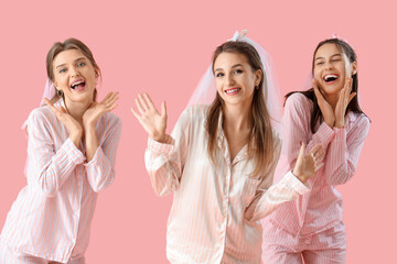 Poster - Young woman with her bridesmaids in pajamas on pink background. Hen Party