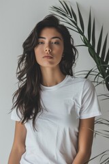 Wall Mural - A woman posing for a photo in a white T-shirt, simple and casual