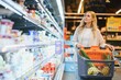 © Serhii - Woman shopping in a supermarket