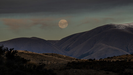 gorgeous moutain view at sunset with moon in the sky