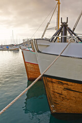 Wall Mural - Boat, harbor and ocean for cargo, transportation and travel with mountains, water and sunshine. Ship, sailing and sea as landscape in New York with clouds for international export, delivery and trade