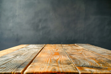 Poster - Empty wooden table top made of planks showing wood grain on blurred gray background