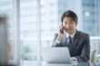 © N7 - 電話会議を主導する日本人経営者