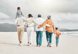 © DavisShared/peopleimages.com - Walking, family and beach back with grandparents, mom and dad with kids together on holiday. Travel, winter and generations with vacation and break by the sea with love, parent care and bonding