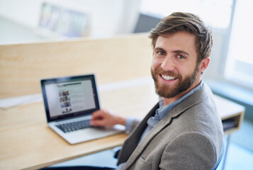 Canvas Print - Portrait, businessman and laptop screen with office, employee and digital agency as web designer. Male person, smile and technology in typing in working, project or deadline with happiness at company