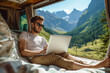 © Patcharaphon - Freelance man working on computer in camper van. Road trip, motor home, work from everywhere concept