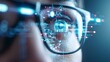 © Sagiam - A close-up of a person's eye with digital data projected over it.  The concept of digital vision and future technology.