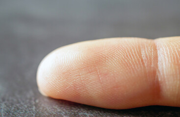 Fingerprint on finger, Close up detail of fingerprint lines on the skin, macro