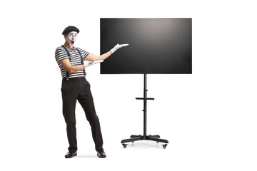 Wall Mural - Full length portrait of a mime presenting a tv show