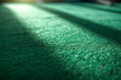 © Tetiana - Green Poker casino table felt fleecy fabric background with light from window Close up. Copy space