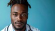 © WS Studio 1985 - Confident Doctor: A close-up portrait of a confident African American doctor with dreadlocks, wearing a white coat and stethoscope