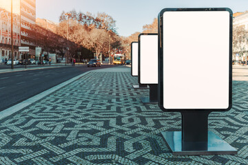 A mockup of a series of blank billboards along a city street with a copy-space area on the left. Perfect for advertising and design projects, showcasing outdoor signage templates and urban marketing