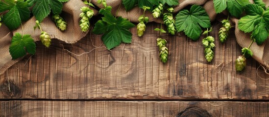 Poster - Rustic wooden surface with hops and sackcloth on it ideal for product display with copy space image