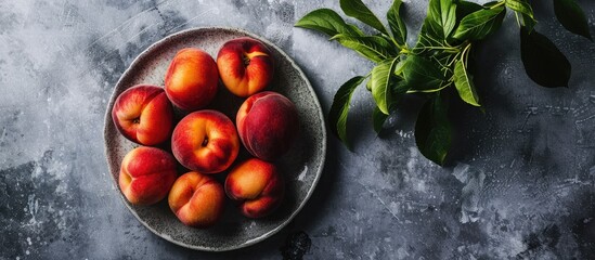 Poster - Plate with fresh ripe peaches showcasing vegetarian theme with copy space image