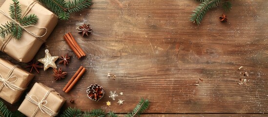 Aufkleber - Rustic wooden background with a Christmas arrangement featuring spruce gifts cinnamon anise and confetti stars in a flat lay top view including copy space image