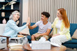 © Maria Vitkovska - Happy family giving high five to therapist celebrating success during therapy session