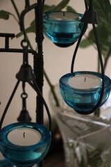 A vertical shot of blue candles