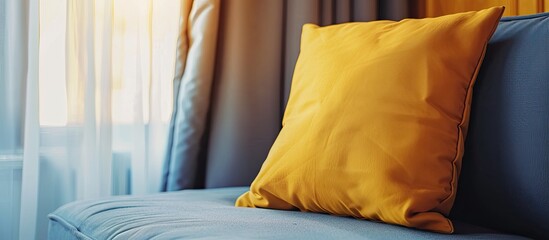 Aufkleber - A grey sofa with a yellow pillow showcased against a background with a curtain provides copy space for an image