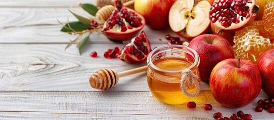 Aufkleber - Traditional Rosh Hashanah items like apples pomegranates and honey are displayed on a white wooden surface in a banner style image symbolizing the Jewish holiday with copy space
