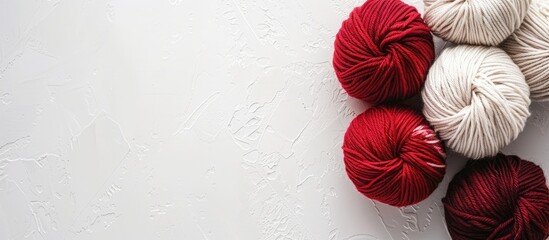 Poster - Stock photo shows merino wool knitting yarn on white backdrop with copy space image available