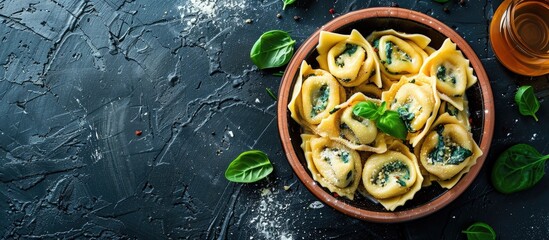 Sticker - Top view of traditional Italian tortelli pasta filled with spinach and cheese with copy space image available