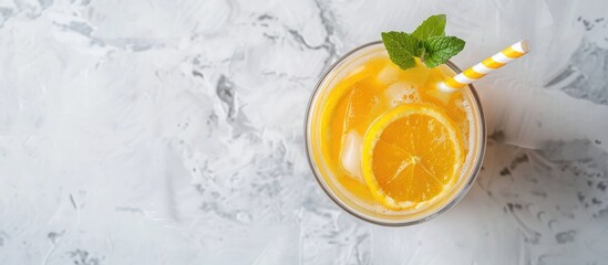 Poster - Overhead view of a summer cocktail with a Kraft paper straw on a light background perfect for adding text or images. Creative banner. Copyspace image