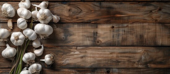 Aufkleber - Top view of garlic displayed on a rustic wooden background with ample copy space image