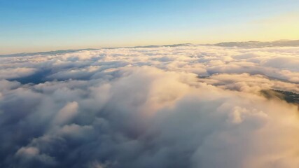 Wall Mural - Cloudscape view from above during sunrise, serene