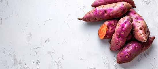Poster - Sweet potato on white background Capture the essence of this vibrant copy space image