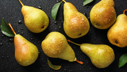 Canvas Print - Fresh ripe pears with water drops on black background. Tasty fruits. Summer harvest. Top view