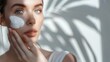 © The Little Hut - Shine cream or woman with skincare dermatology or wellness on a white studio background Person aesthetic or model with creme moisturiser or luxury with self care beauty or cosmetics wi : Generative AI