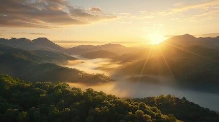 Wall Mural - The sun is setting over a mountain range, casting a warm glow over the landscape. The misty atmosphere adds to the serene and peaceful mood of the scene