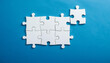 © hardvicore - White puzzle pieces on blue background. Brain game.