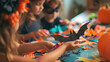 © Preeyada - Children Crafting Halloween Decorations with Paper Bats and Pumpkins in a Festive Setting