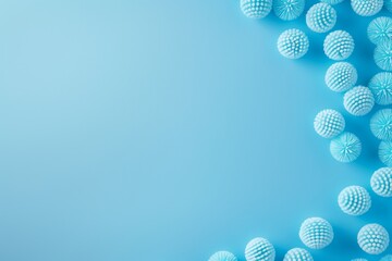 A simple and minimalistic arrangement of blue balls on a light blue background, representing simplicity and clarity.