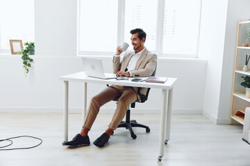 Wall Mural - Laptop man computer happy office caucasian smiling business lifestyle businessman executive sitting