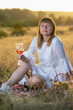 © Олег Мальшаков - Beautiful young girl with a glass of wine on a picnic