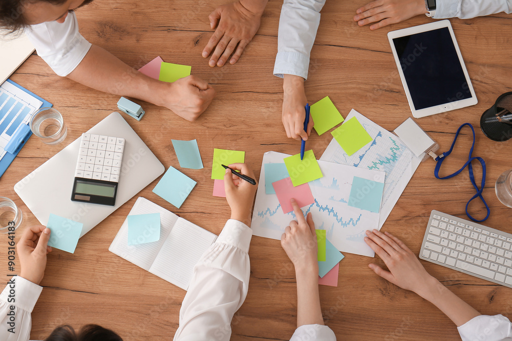 Business team with many sticky notes during meeting in office, closeup