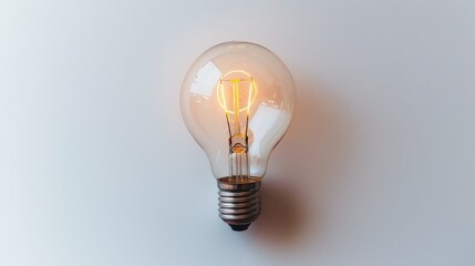Aufkleber - A modern light bulb, glowing warmly, is set against a white background. The visible filaments and warm light symbolize ideas, creativity, and a modern touch.
