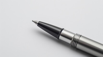 Aufkleber - A close-up image of a stainless steel ballpoint pen, showcasing its sleek design, resting on a plain white background, highlighting its modern elegance.