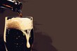 © peerasak - A glass of beer is poured into a glass