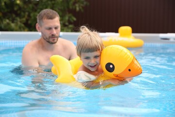 Poster - Happy daughter and her father swimming in pool