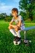 © 3Days2Go Media - Smiling muddy little soccer boy goalkeeper, resting on bench after game