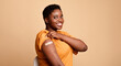 © Prostock-studio - Successful Coronavirus Vaccination. Black Woman Showing Vaccinated Arm After Covid-19 Vaccine Injection Shot Posing Smiling To Camera On Beige Background. Corona Virus Immunization Concept. Panorama