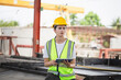 © JU.STOCKER - Factory foreman worker in hardhat at the precast factory site, Female engineer checking project at construction site