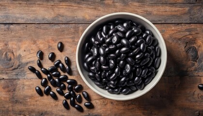 Canvas Print -  A bowl of black olives on a rustic wooden surface